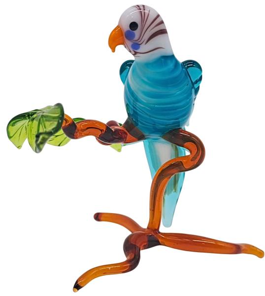 kleiner Wellensittich auf Ast, stehend (türkis)