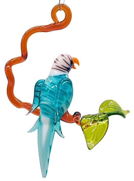 kleiner Wellensittich auf Ast, türkis